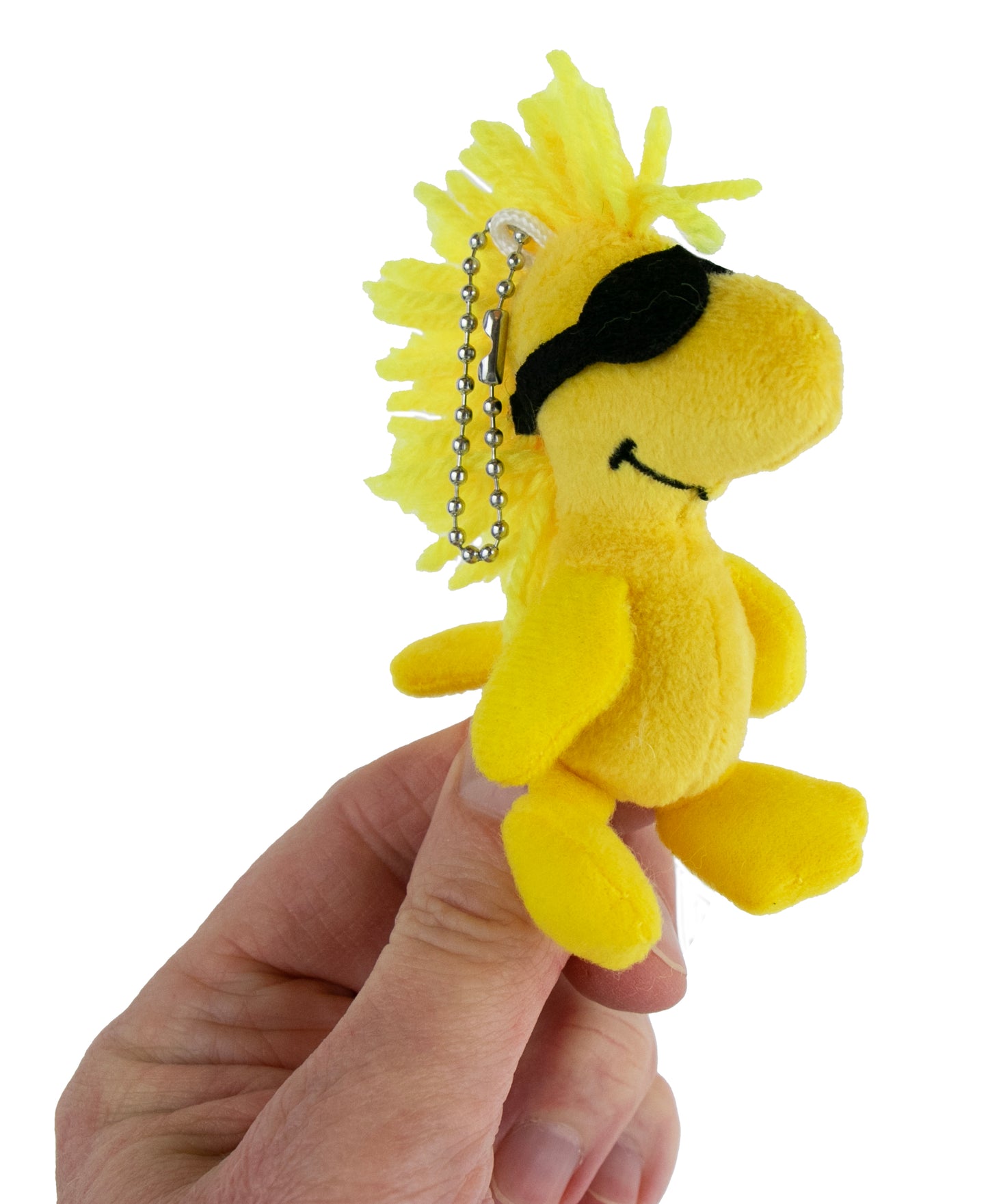 hand holding woodstock plush