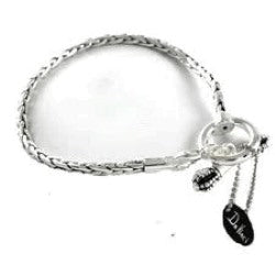 Silver bracelet with a heart charm on a white background