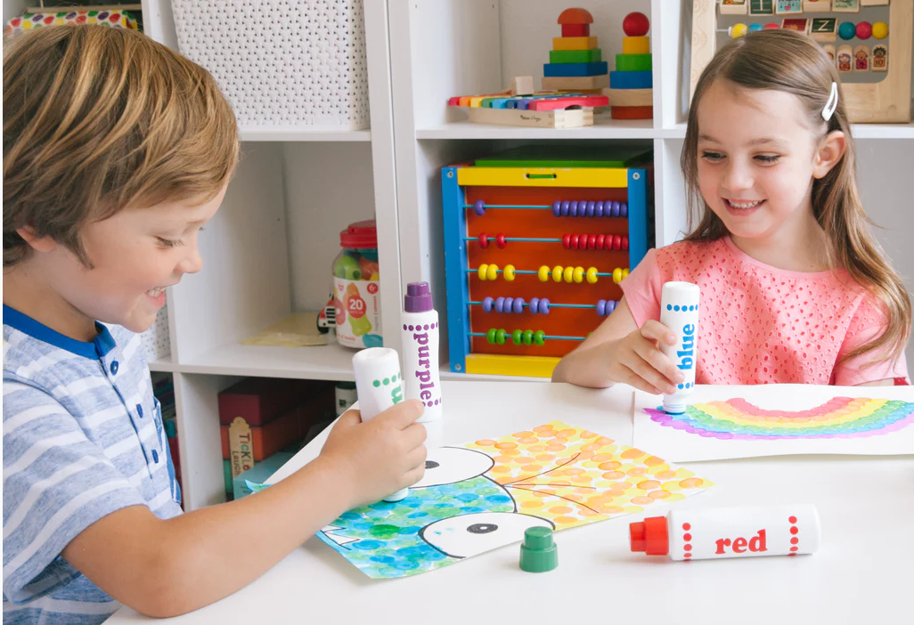 Kids using do-a-dot markers