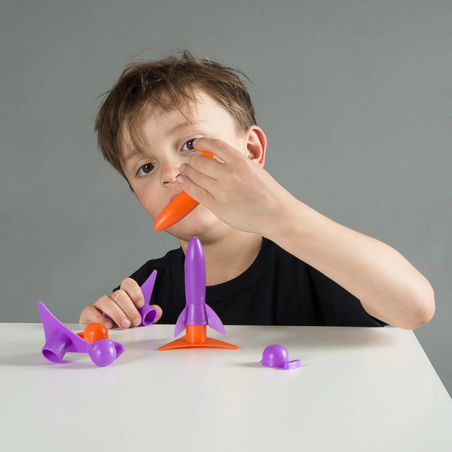 kid playing with fizz rocket