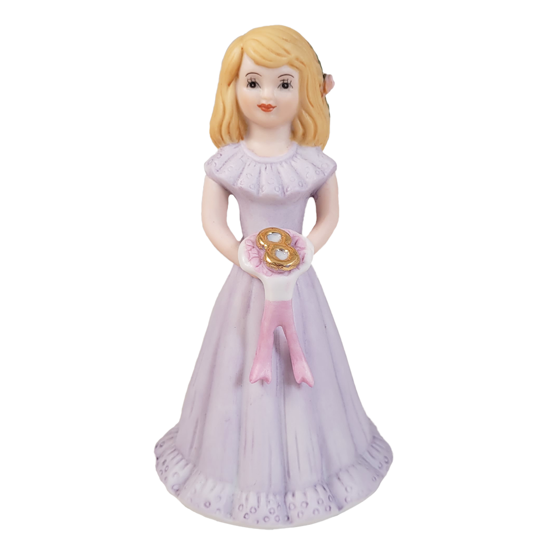 Front of figurine of a girl in a purple dress holding a bouquet with a number 8 on a white background