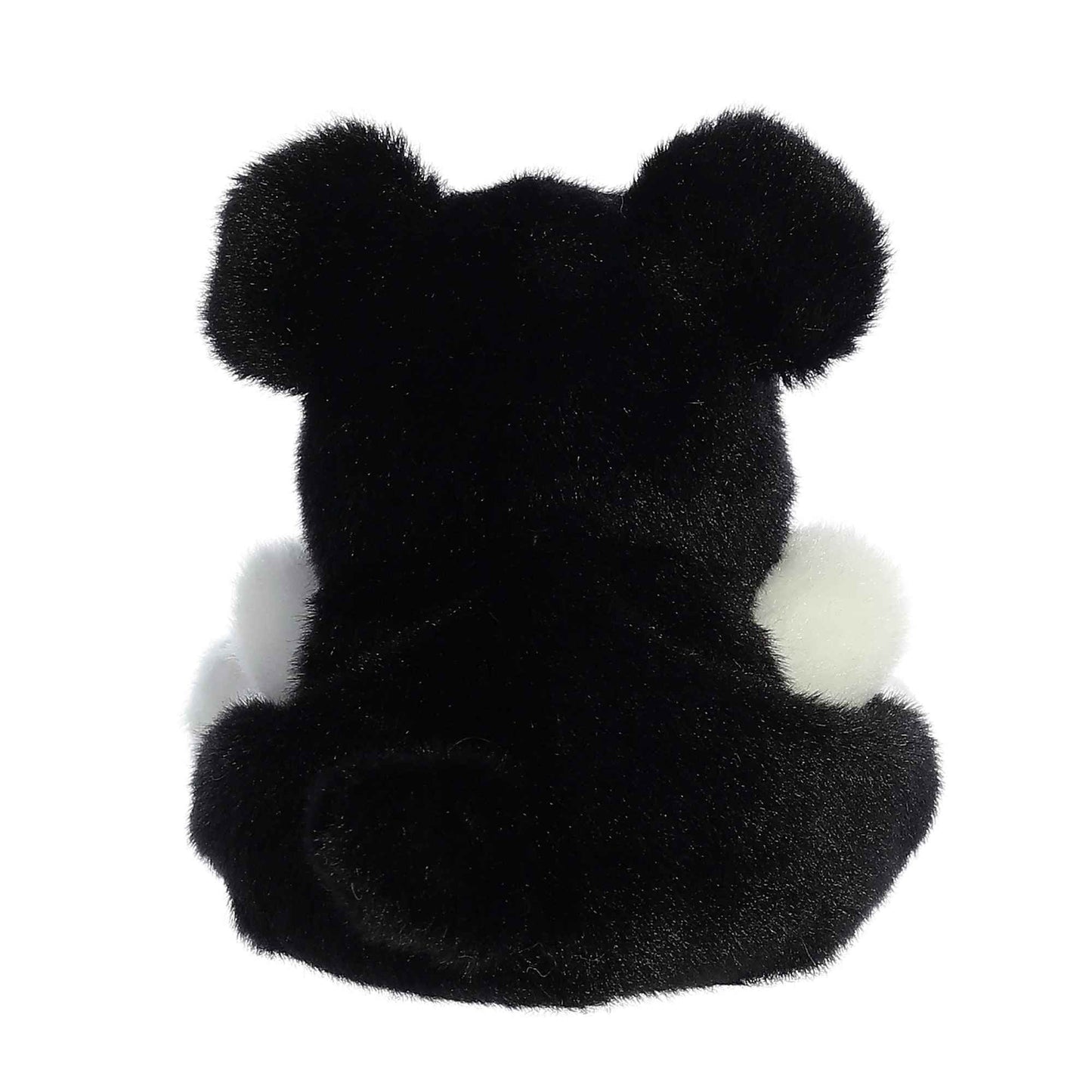 black and white dog palm pal back