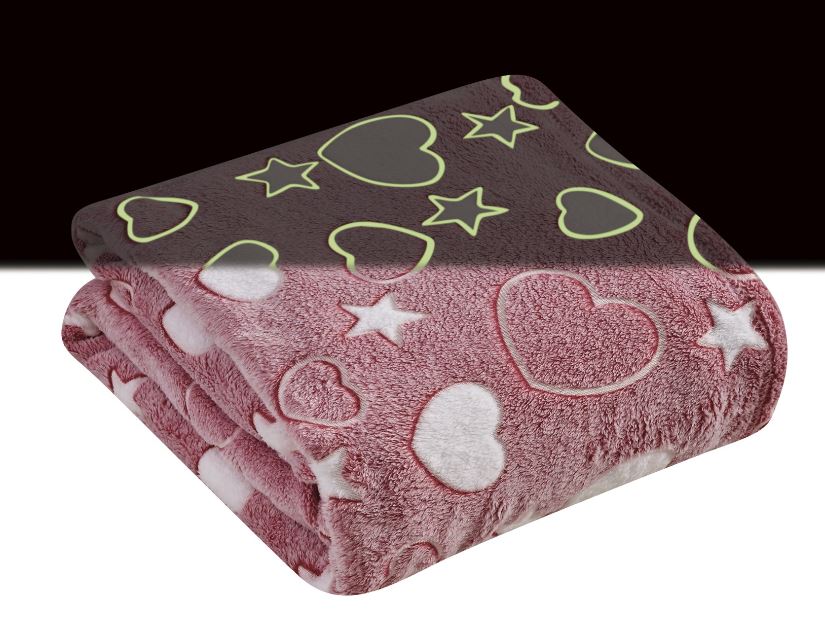 folded pink blanket with glow in the dark hearts and stars