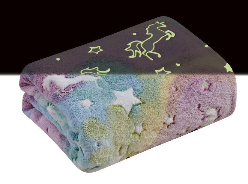 folded colorful blanket with unicorns and stars that glow in the dark