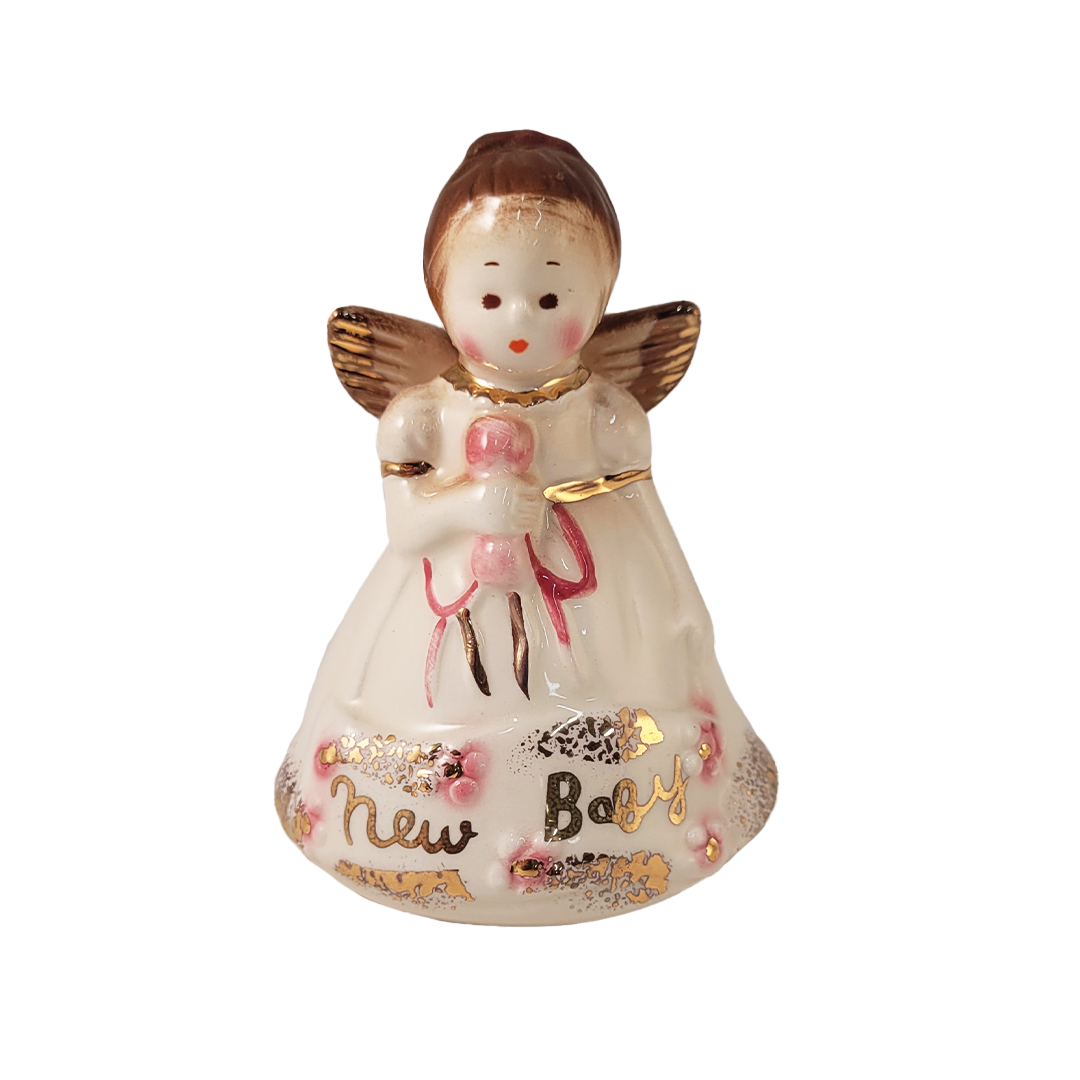 Front of decorative angel figurine with 'New Baby' text with gold accent on a white background