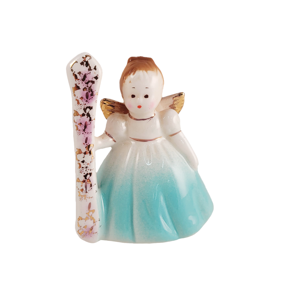 Small angel figurine holding a number 1 on a white background