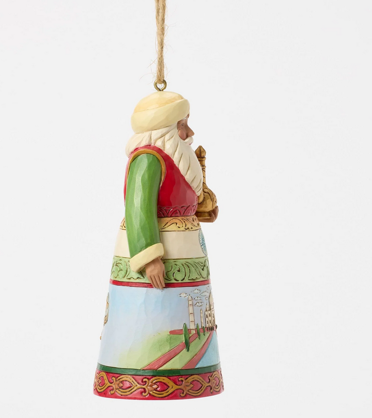Right side of decorative ornament of a Santa with a colorful outfit featuring Indian culture on a white background