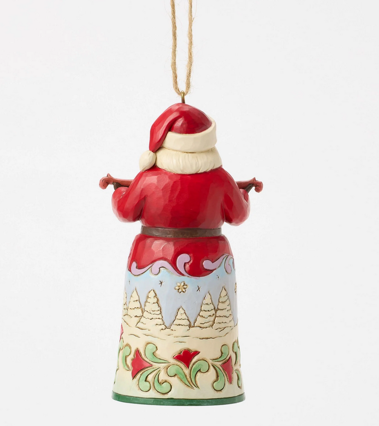 Back of decorative Christmas ornament featuring a Santa Claus figure with bells