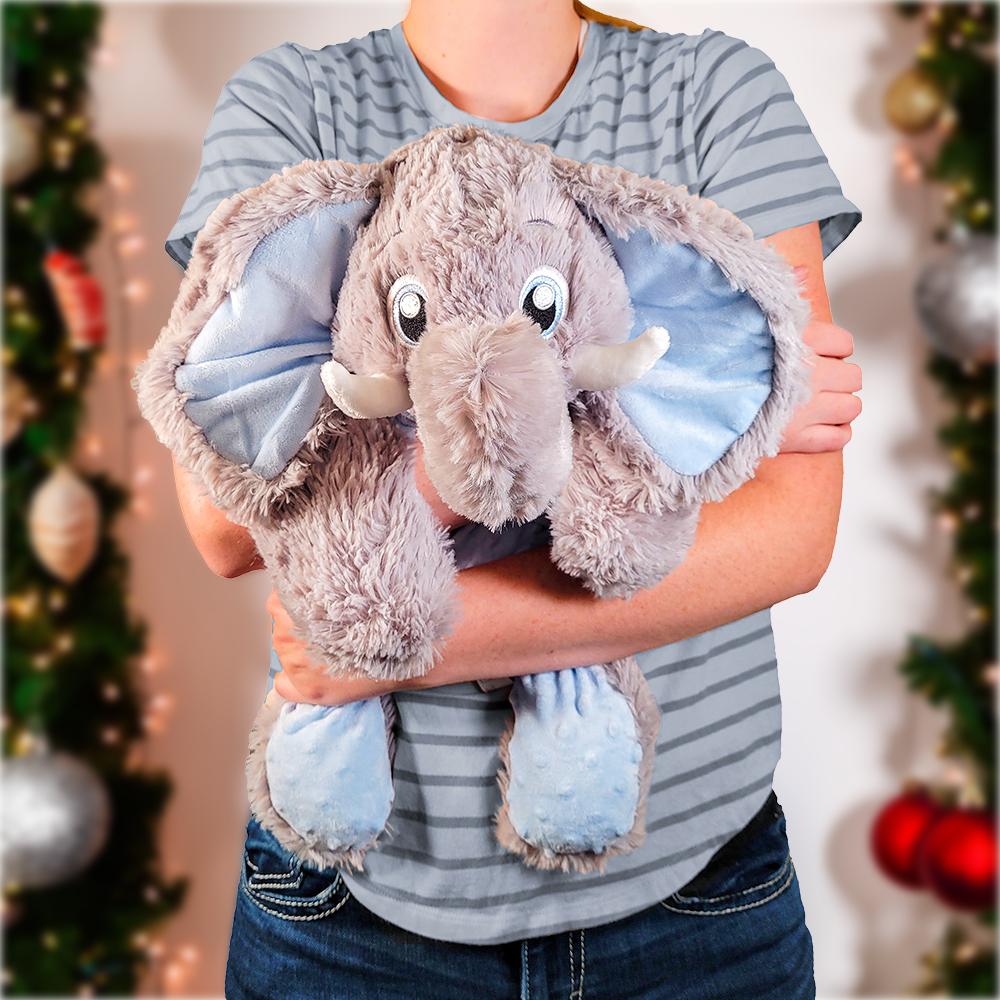 woman holding elephant plush