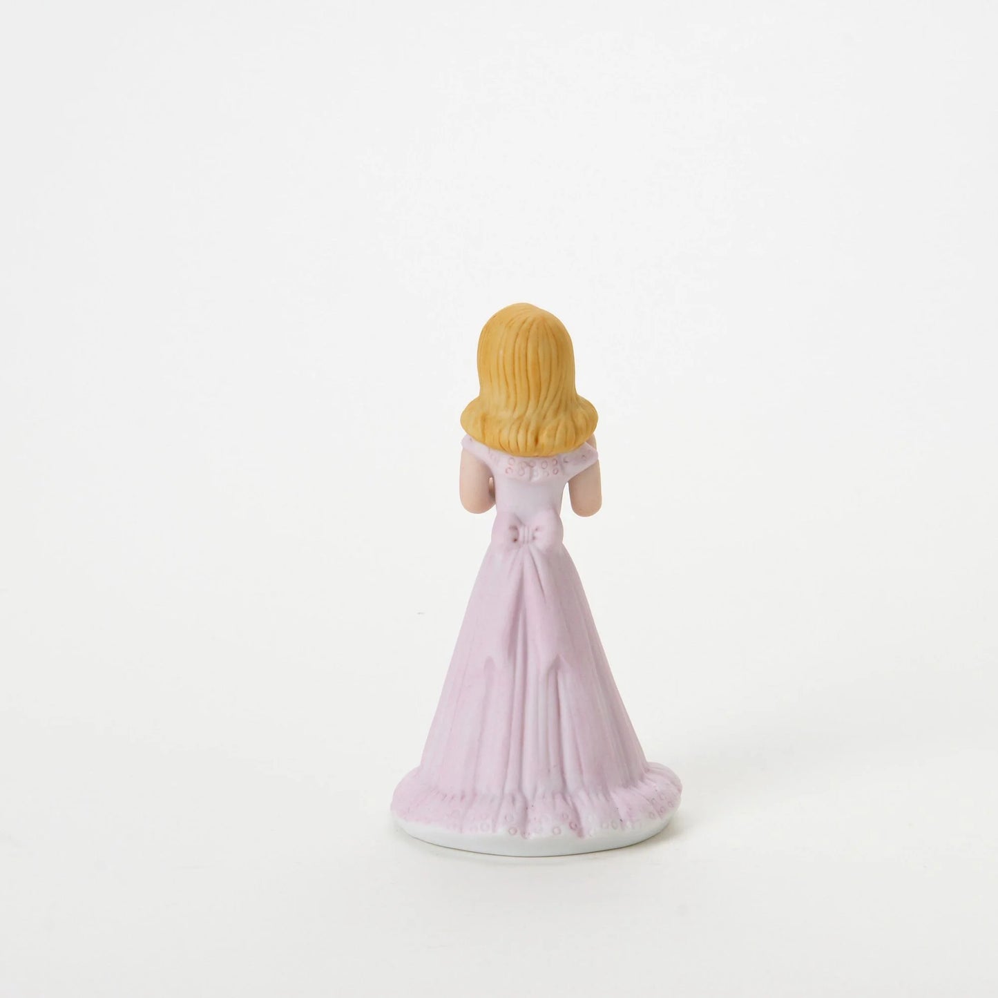age 9 figurine back