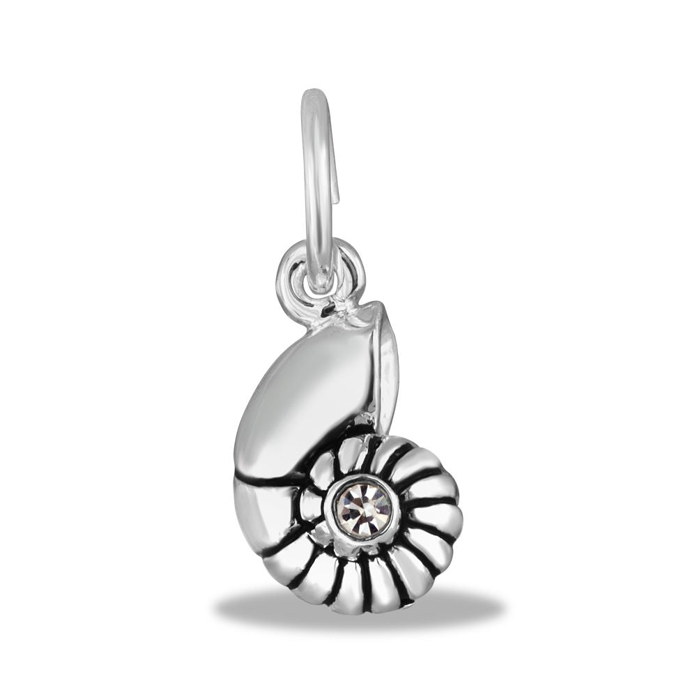 A silver-colored metal charm in the shape of a hermit shell with a small clear crystal in the center.