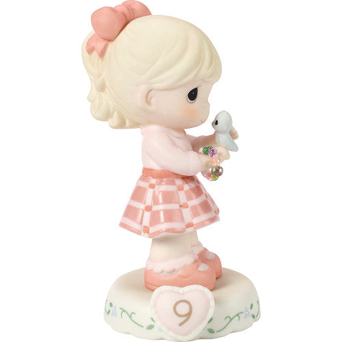 age 9 figurine side