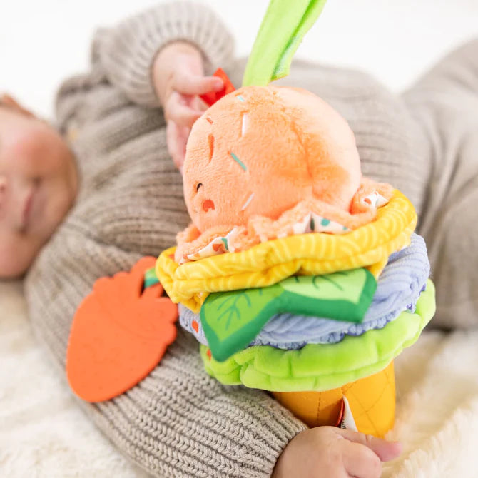 child holding take along toy