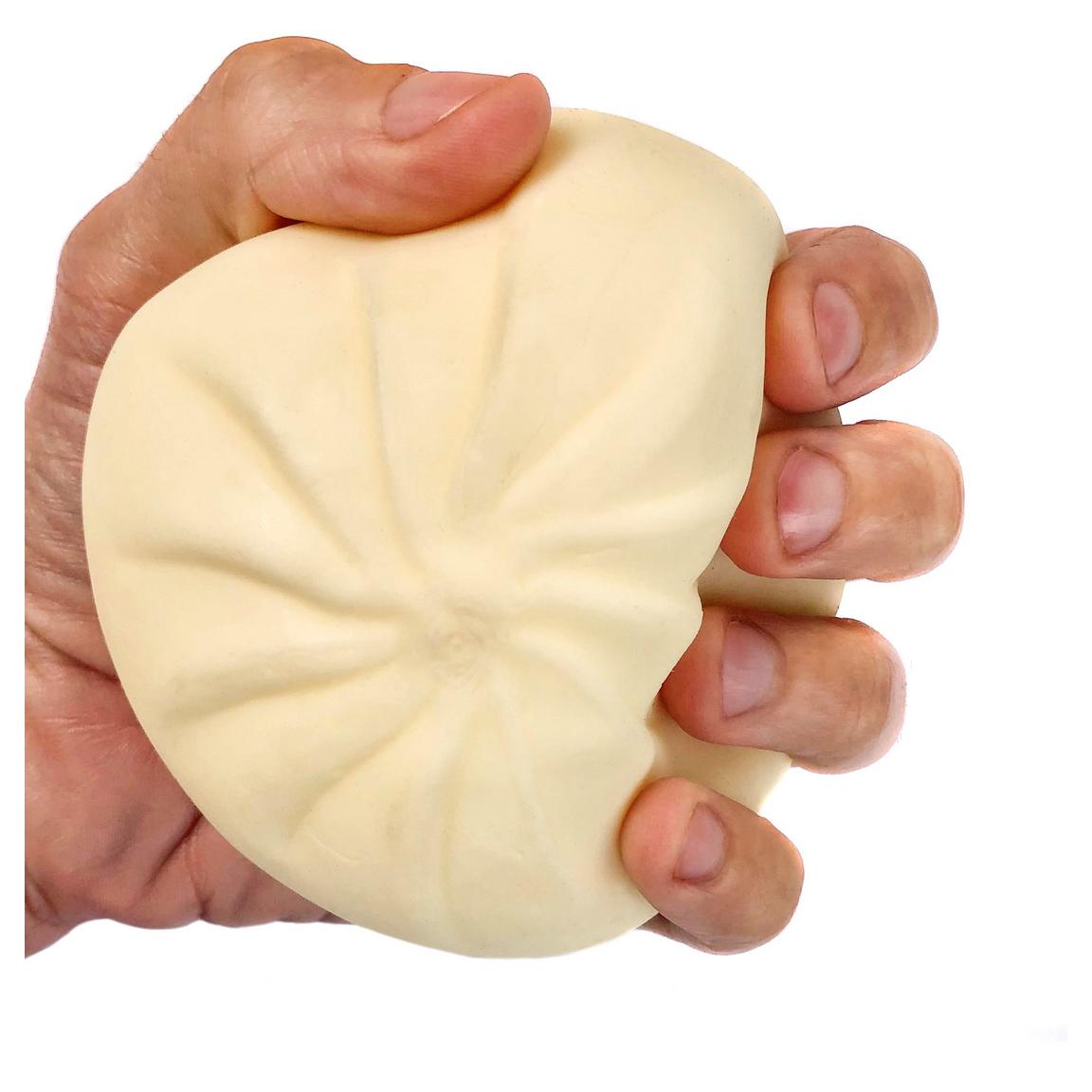 hand squishing dumpling
