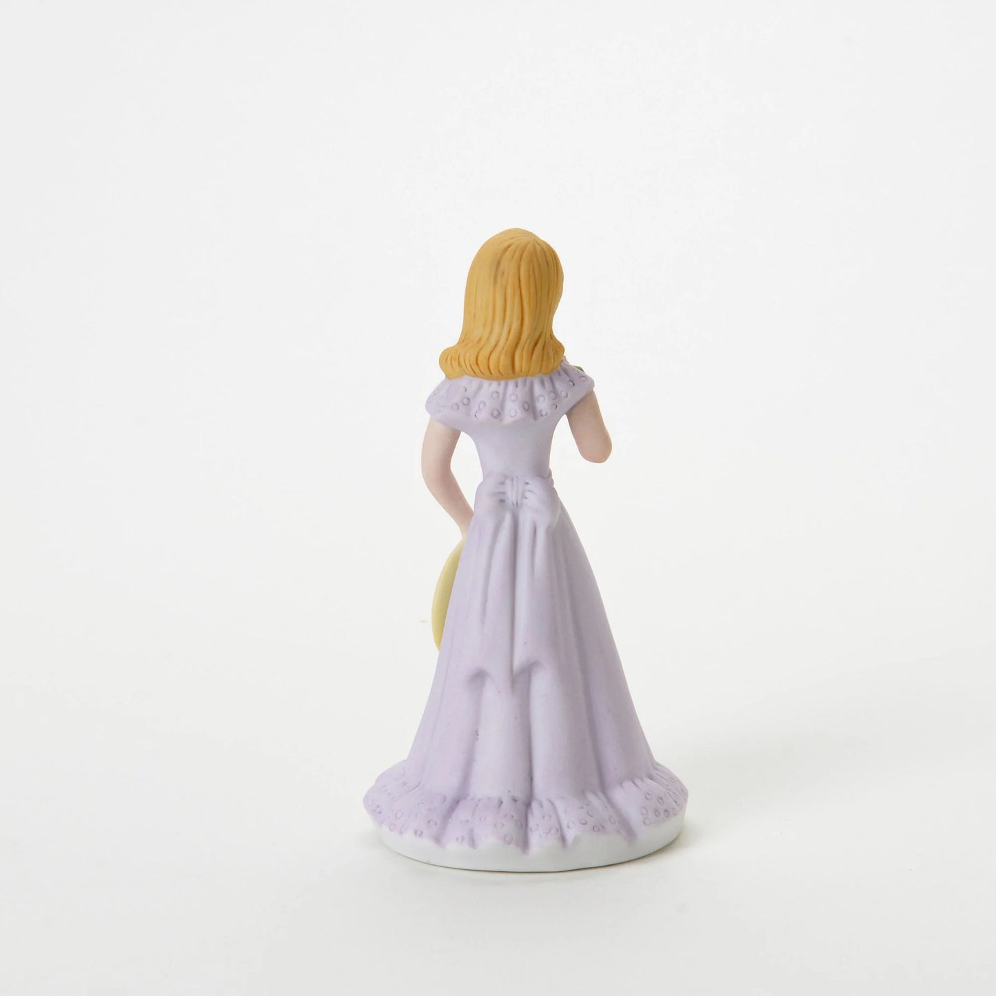 age 12 figurine back