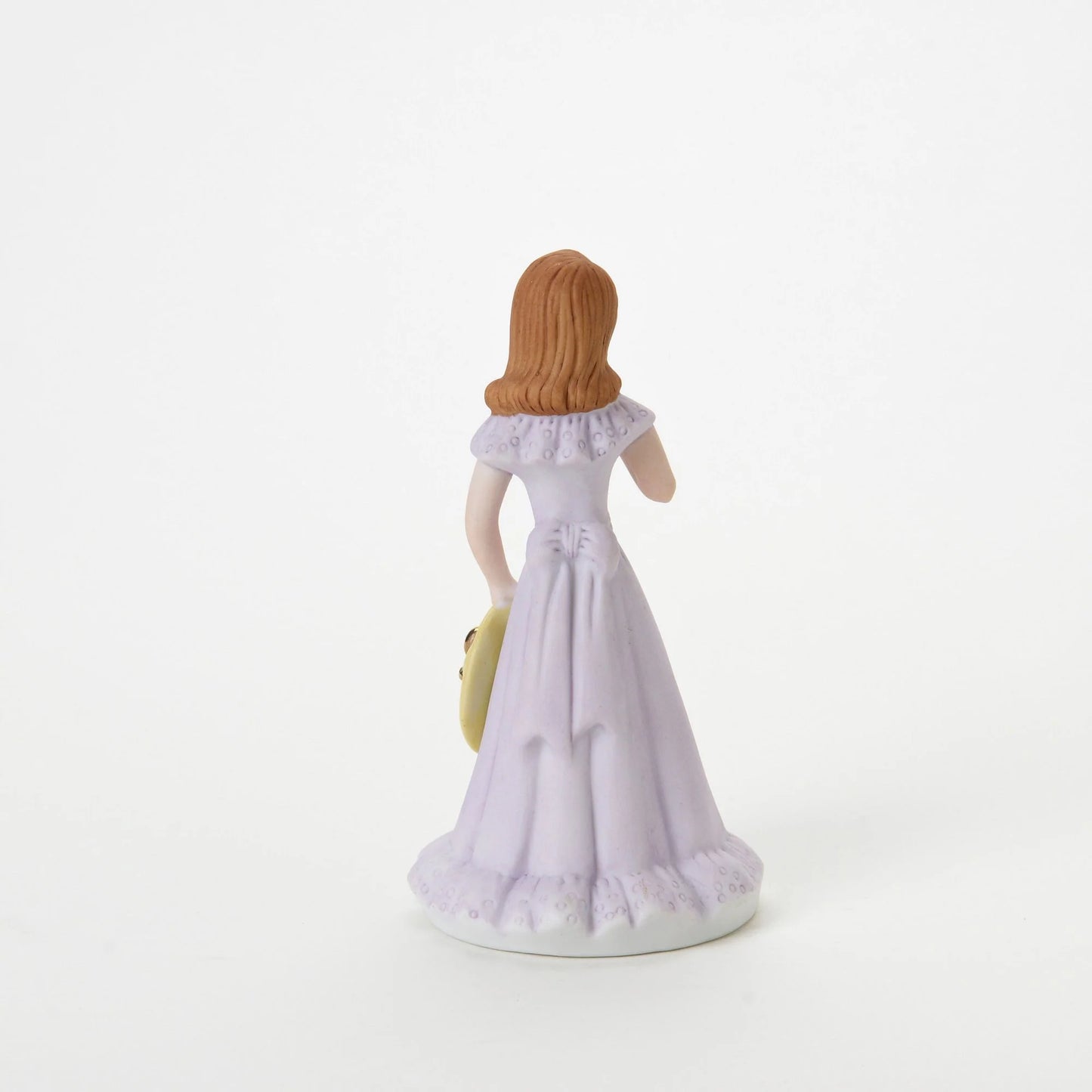 age 12 figurine back
