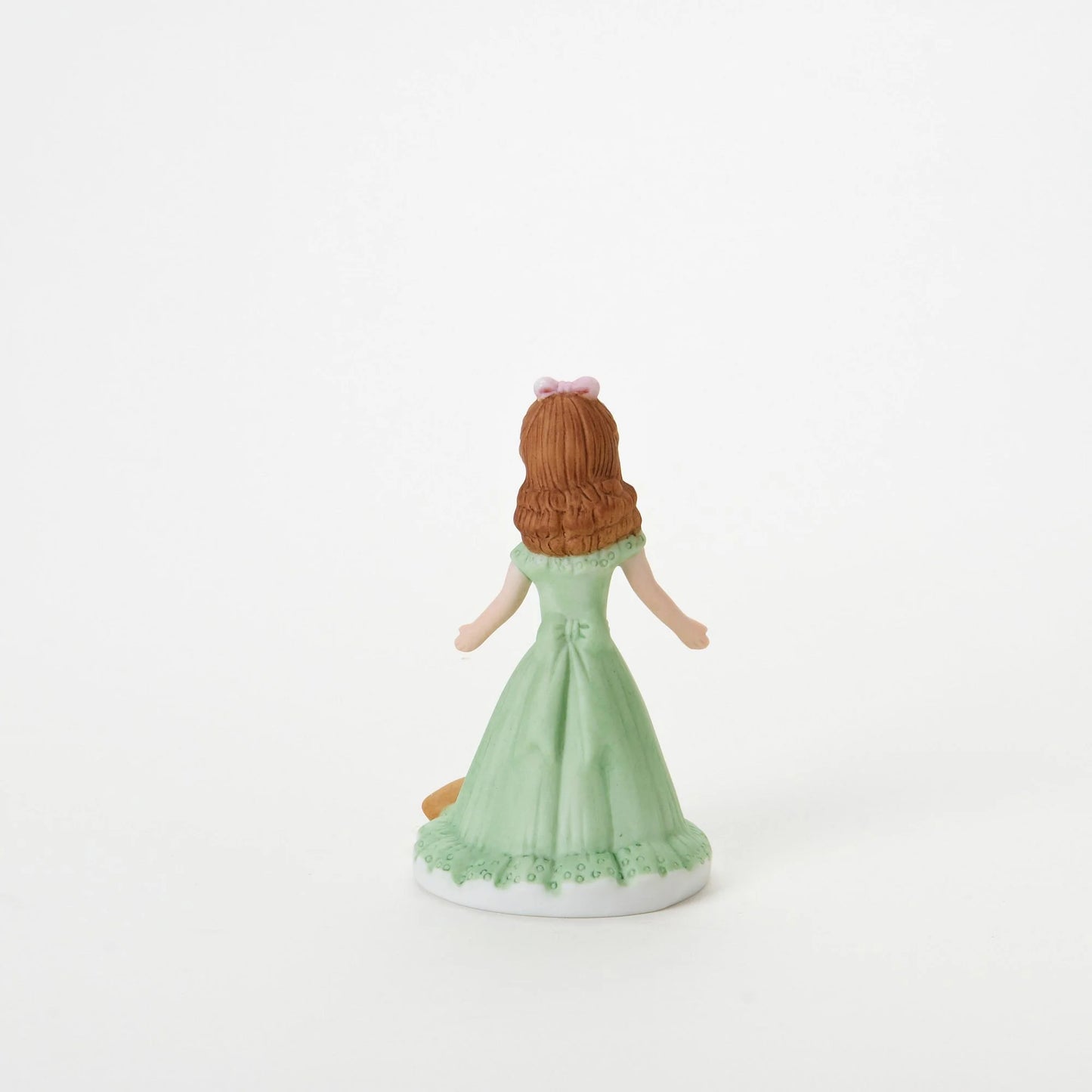 age 7 figurine back
