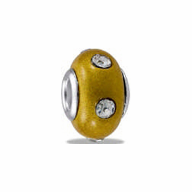 A yellow bead with clear CZ insets