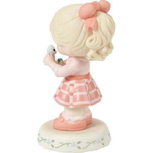 age 9 figurine back