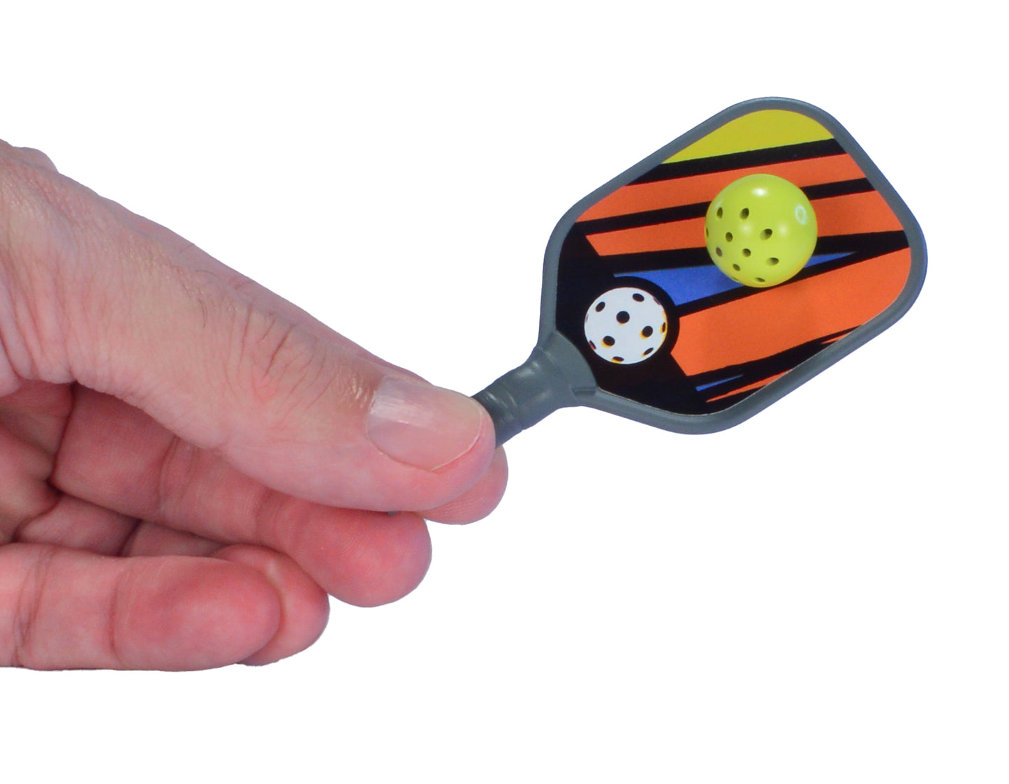 hand holding pickleball