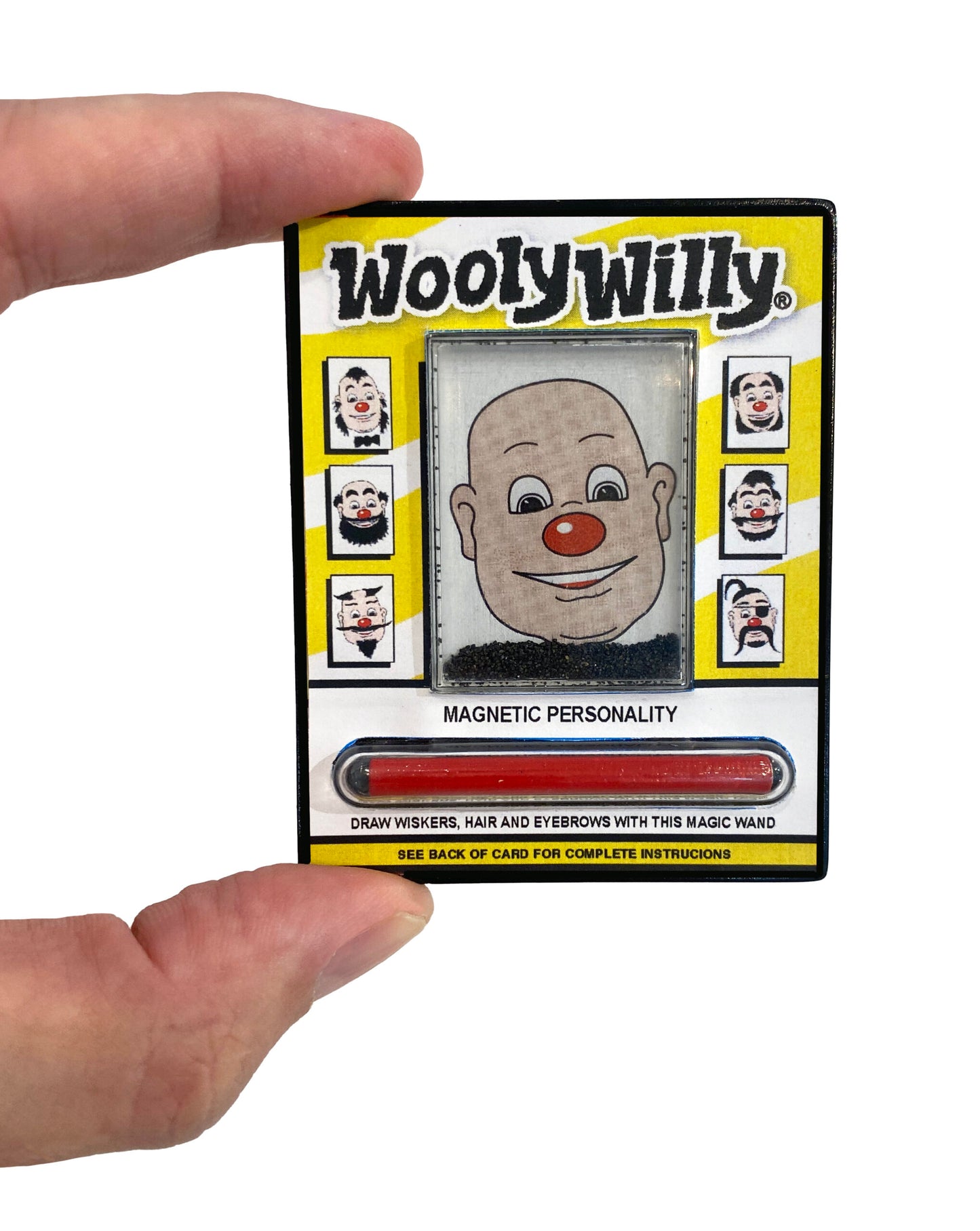 finger holding wooly willy