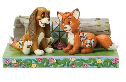 Front of figurine of Tod and Copper from The Fox and the Hound on a decorative base on a white background