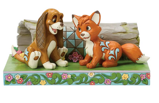 Front of figurine of Tod and Copper from The Fox and the Hound on a decorative base on a white background
