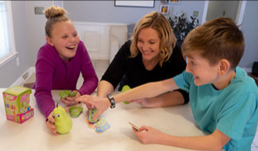 Family playing pear game