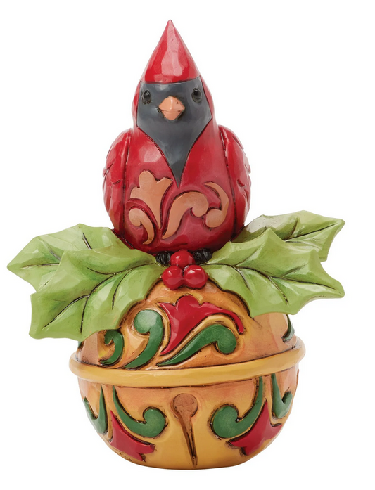 Decorative cardinal figurine on bell a white background
