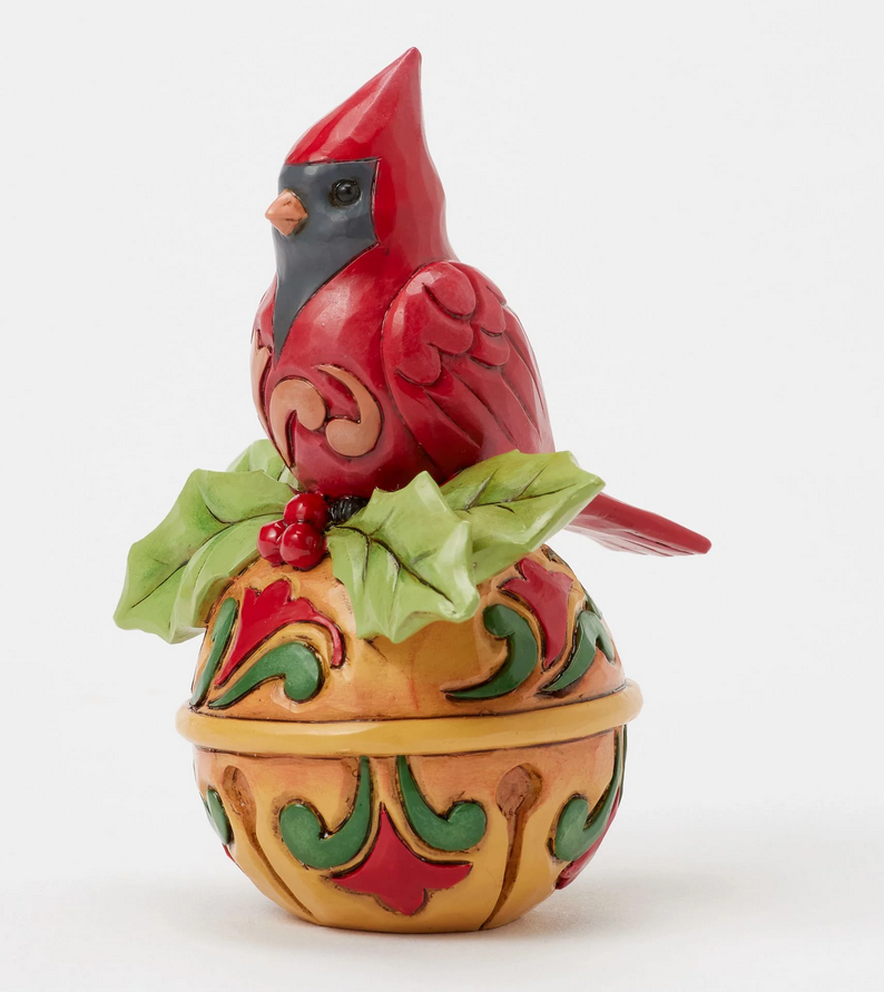 Quarter view decorative cardinal figurine on bell a white background