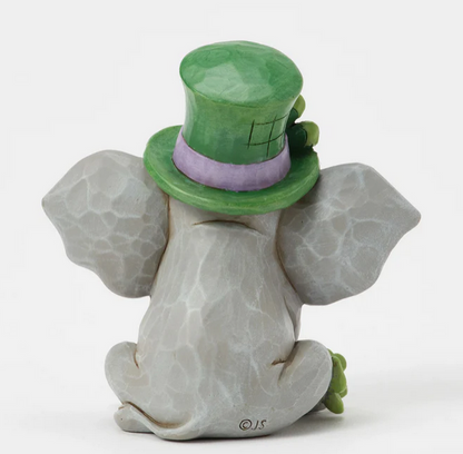 Back of elephant figurine wearing a green top hat on a white background