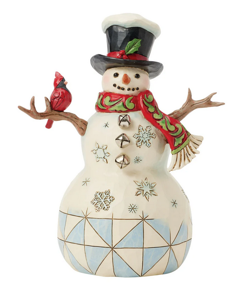 Decorative snowman figurine with geometric patterns and a cardinal