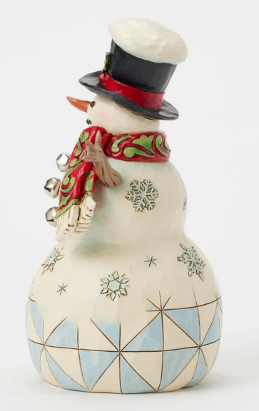 Decorative snowman figurine with geometric patterns and a cardinal - side view