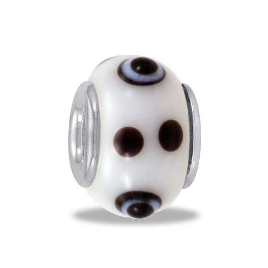 silver bead with white enamel and black dots