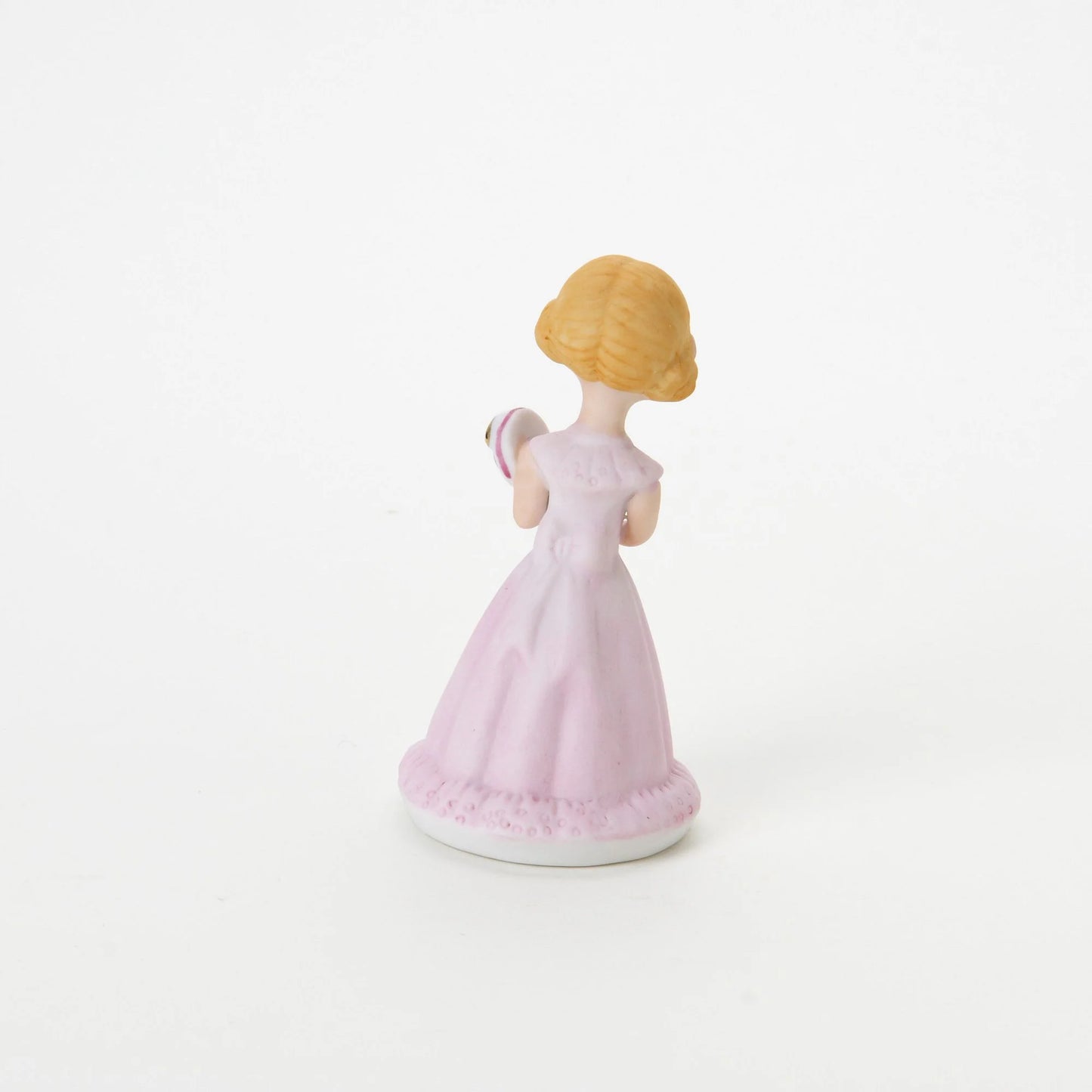 age 5 figurine back