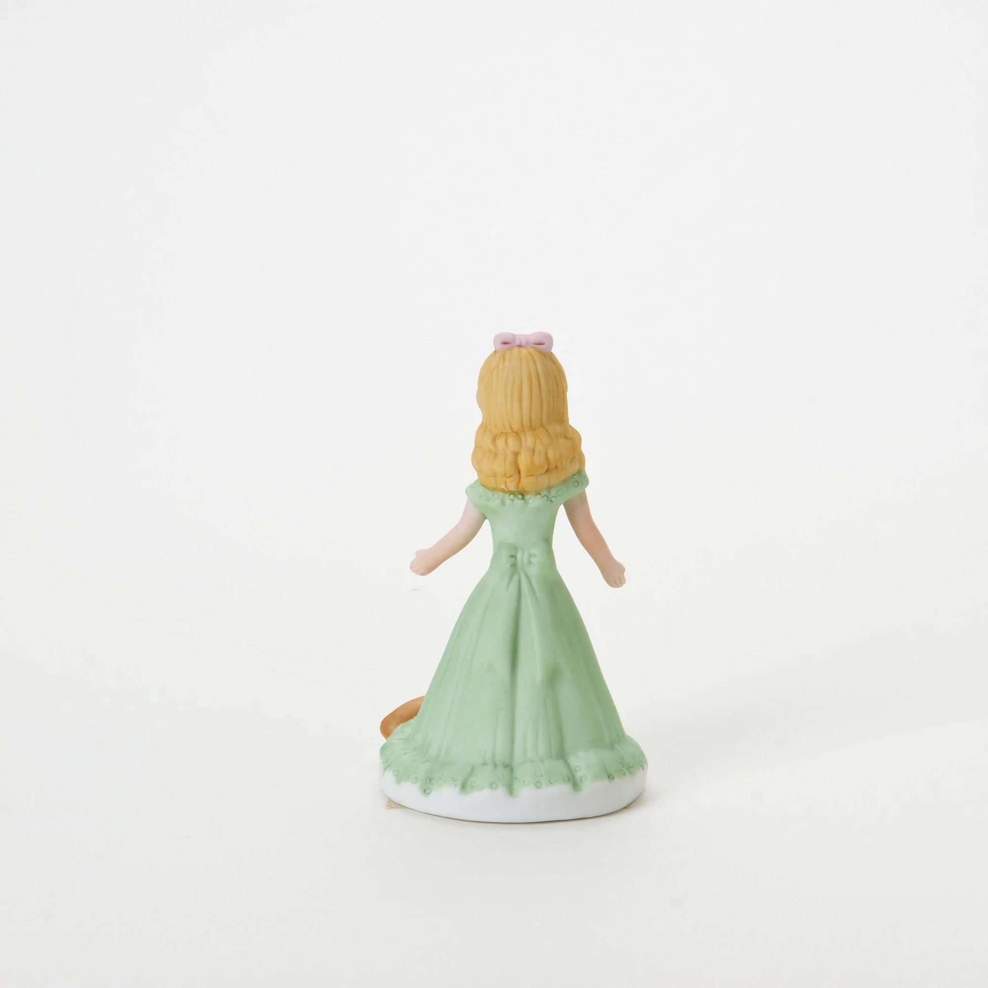 age 7 figurine back