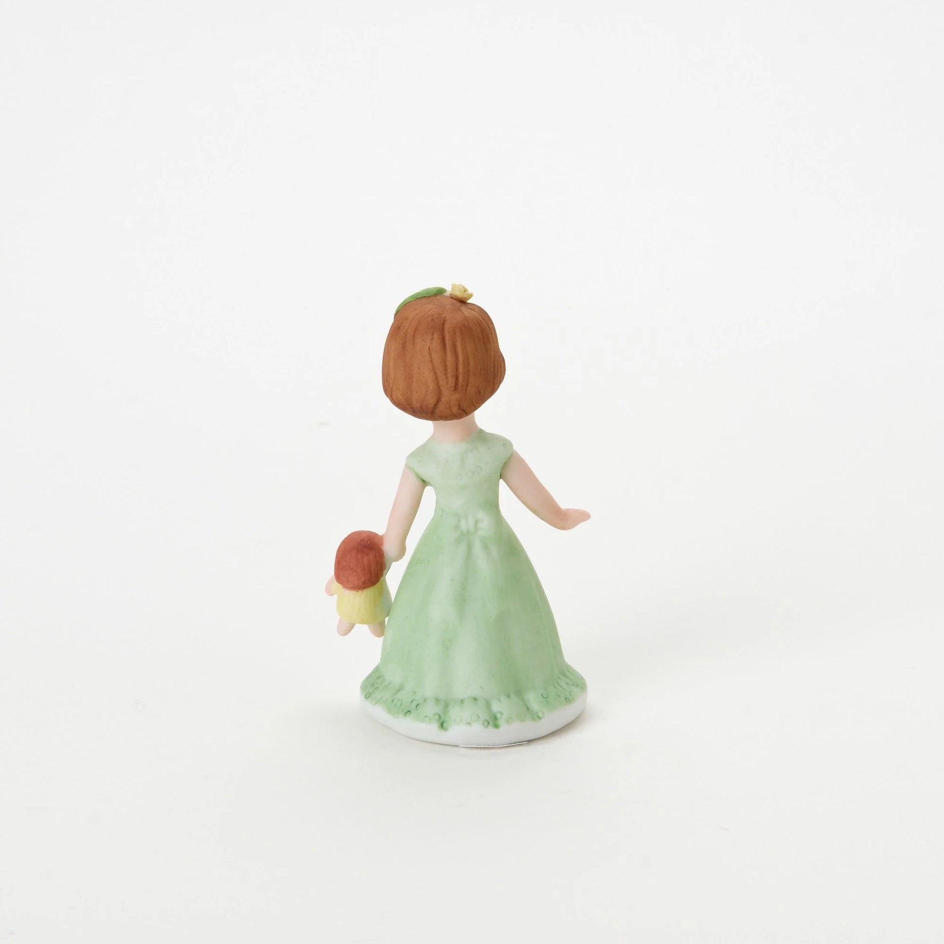 age 3 figurine back