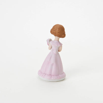 age 5 figurine back