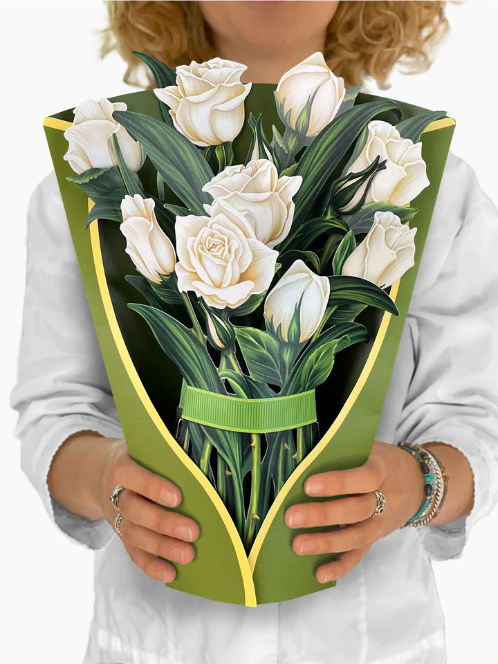person holding white rose bouquet